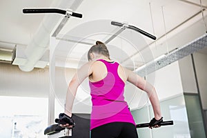 Fit woman doing pull up