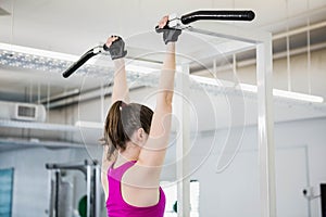 Fit woman doing pull up