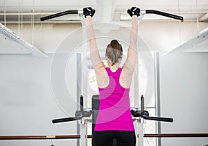 Fit woman doing pull up