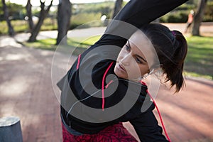 Fit woman doing stretching exercise