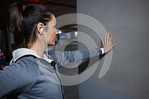 Fit woman doing stretching exercise