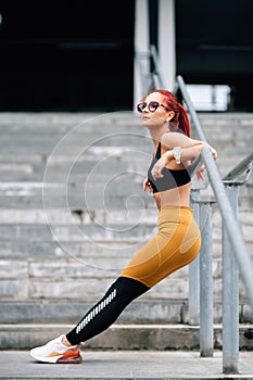 fit woman doing stretching exercises and planks. Gym fitness sport concept