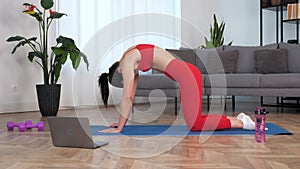 Fit woman doing warm-up stretching exercise training on yoga or fitness mat