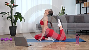 Fit woman doing warm-up stretching exercise training on yoga or fitness mat