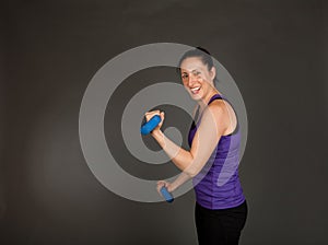 Fit woman doing weight training