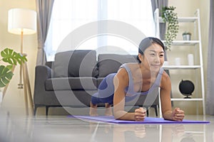 Fit woman doing yoga and meditation at home, sport and healthy lifestyle concept