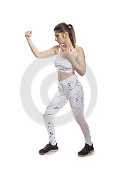 Fit Woman In a Fighting Stance Punching