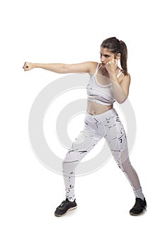 Fit Woman In a Fighting Stance Punching