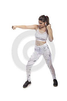 Fit Woman In a Fighting Stance Punching