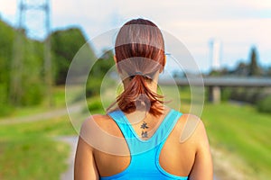 Fit woman jogging away from the camera