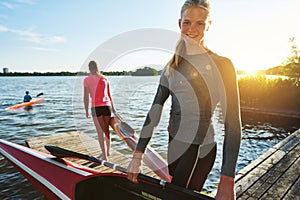 Fit woman with a kayak