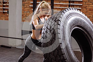 Fit woman is keeping fit with wheel. active lifestyle
