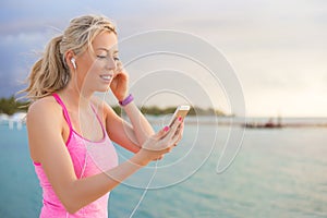 Fit woman listening to music while working out