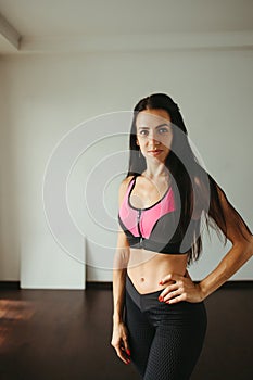 Fit woman with perfect muscular body in activewear