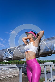 Fit woman runner stretching outdoors