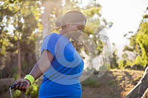 Fit woman skipping rope in the park