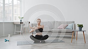 Fit Woman Stretching Arms Warming Up Before Workout At Home