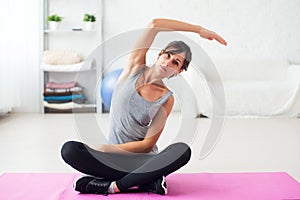 Fit woman stretching her back exercise for spine