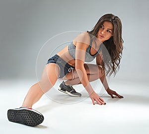 Fit woman stretching her leg to warm up your body.