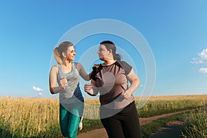 Fit woman support and motivate friend at workout