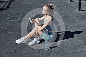 fit woman in tight activewear sitting