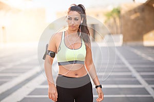 Fit woman timing her heart rate with watch