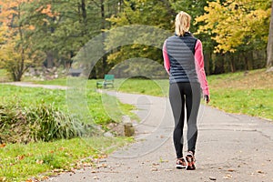 Fit woman walking in park