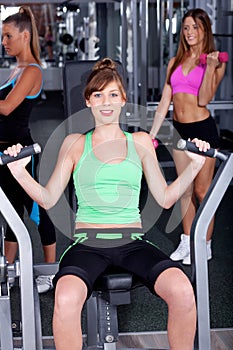 Fit woman working out at gym