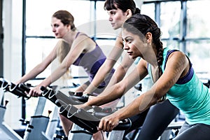 Fit woman working out at spinning class