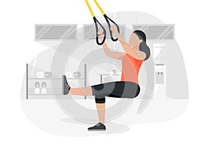 Fit woman working out on trx doing bodyweight exercises. Fitness strength training workout.