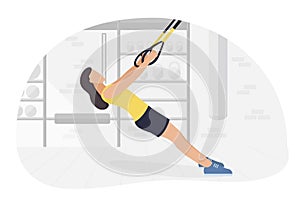 Fit woman working out on trx doing bodyweight exercises. Fitness strength training workout.