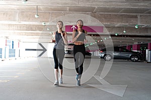 Fit women in sport clothing jogging outdoors and living a healthy lifestyle