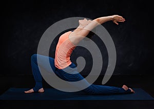 Fit yogini woman practices yoga asana