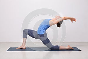 Fit yogini woman practices yoga asana