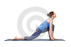 Fit yogini woman practices yoga asana Anjaneyasana