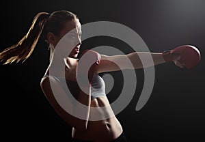 Fit, young, energetic woman boxing