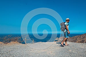 A fit young man climbing a mountain. backpacking concept
