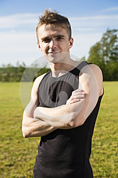 Fit young man posing in the park