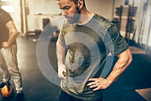 Fit young man sweating after a gym workout session