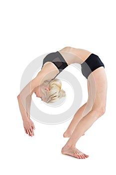 Fit young woman bending backwards