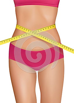 Fit young woman body with measured waistline.