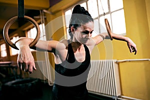 Fit young woman exercising at gym