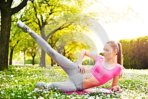 Fit young woman exercising outdoors