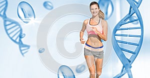 Fit young woman running by DNA structure