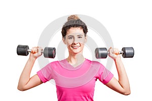 Fit young woman training her deltoids with barbells photo