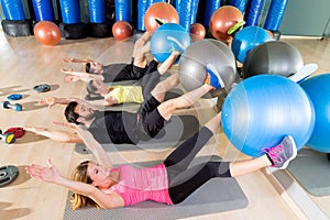 Fitball crunch training group core fitness at gym photo
