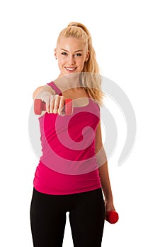 Fitnes - Blonde young woman working out with dumbbells isolated