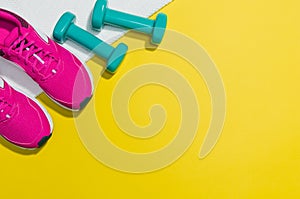 Fitness accessories on yellow background mock up, top view