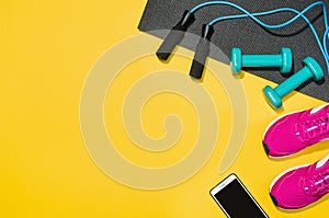 Fitness accessories on yellow background mock up, top view