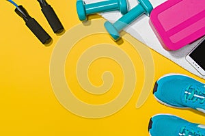 Fitness accessories on yellow background mock up, top view